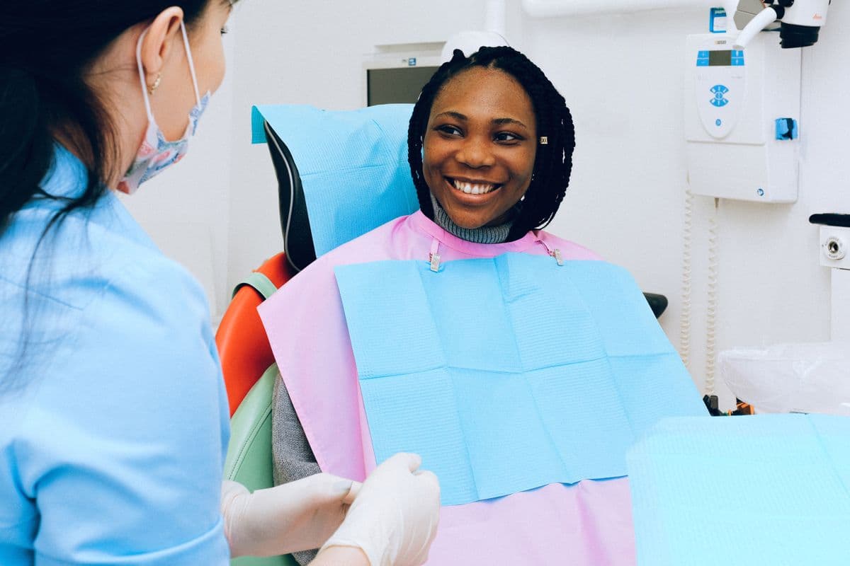 Dentist consulting with a patient in a modern clinic about treatment planning